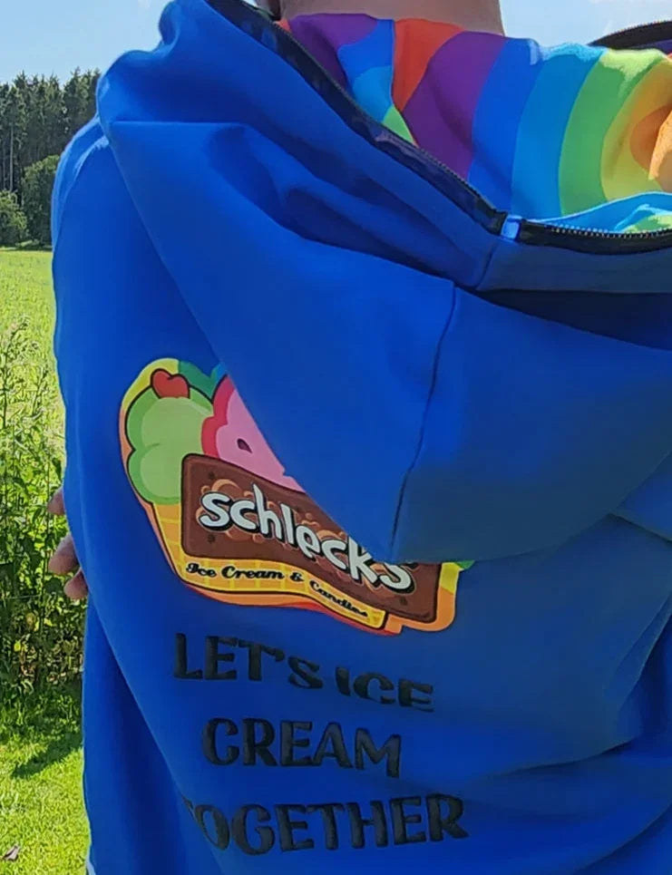 Blue hoodie with Schleck's Ice Cream & Confectionery logo and text, worn by a person outdoors.